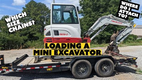 how to load a mini cat excavator on a trailer|unloading mini excavator on trailer.